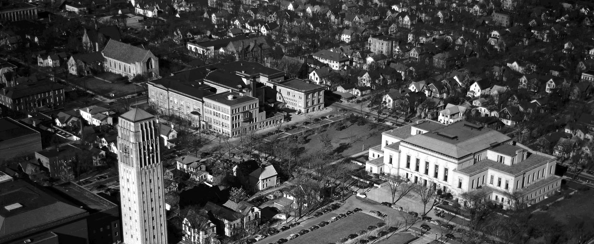 Aerial view of the Ann Arbor central campus, showing the Bell Tower, the Michigan League, and the Rackham Building.