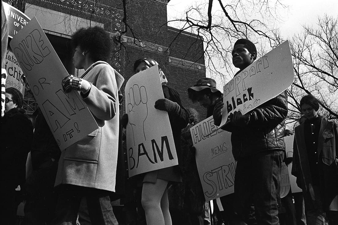 Picketers carry signs outside of Hill Auditorium at a Black Action Movement strike.