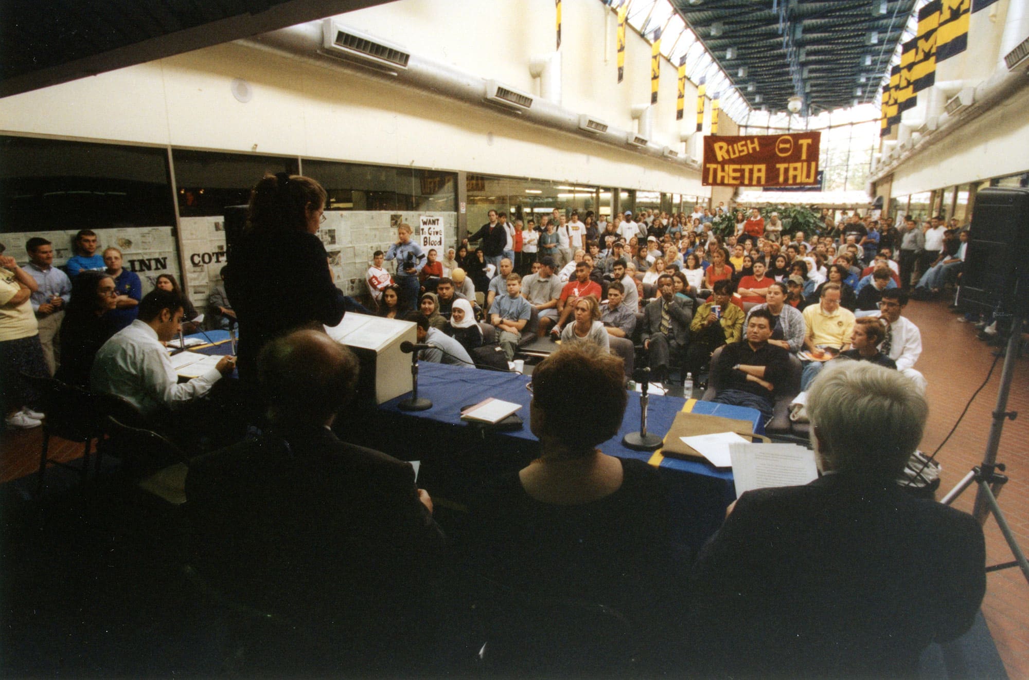 A large crowd listens to speakers at the 9/11 town hall.