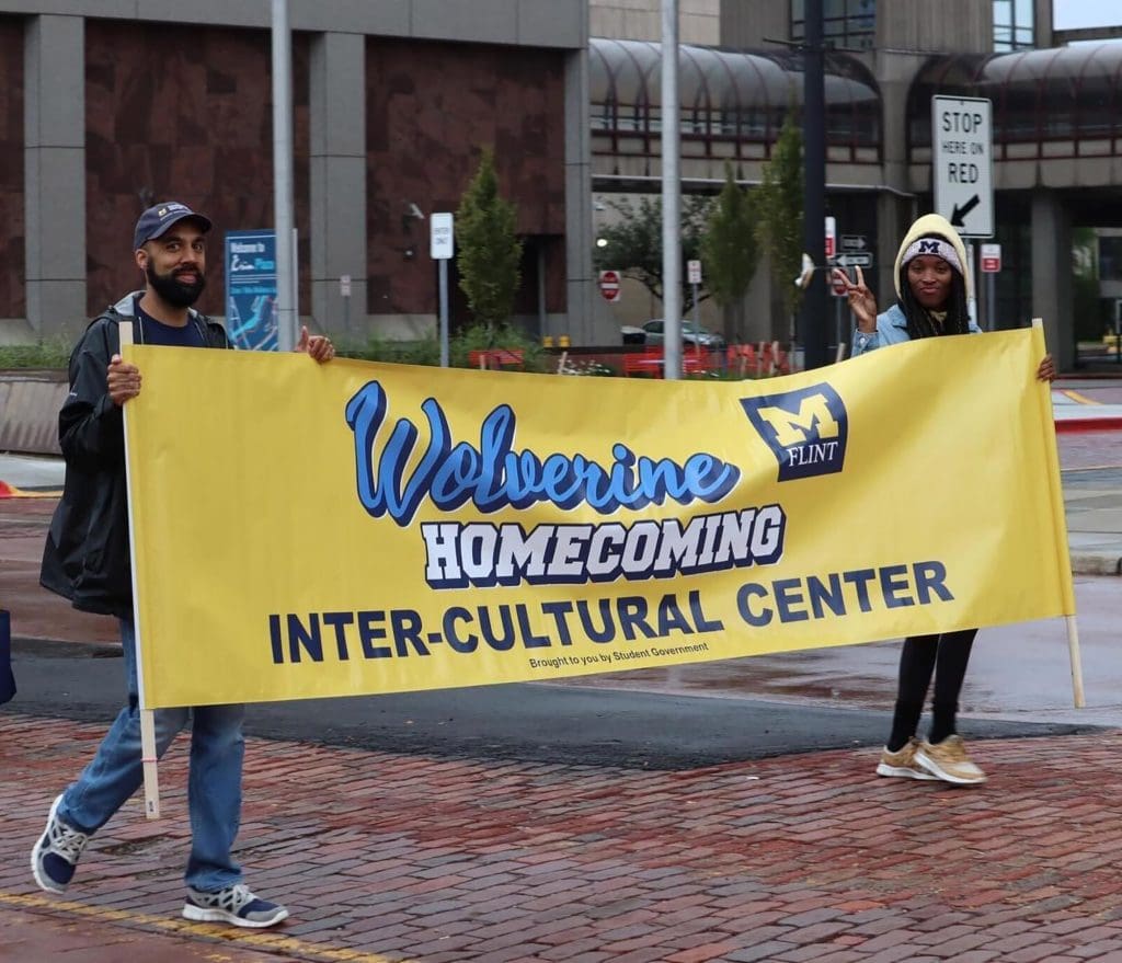 Intercultural Center staff participating in the UM-Flint Homecoming Parade, Sept. 2022