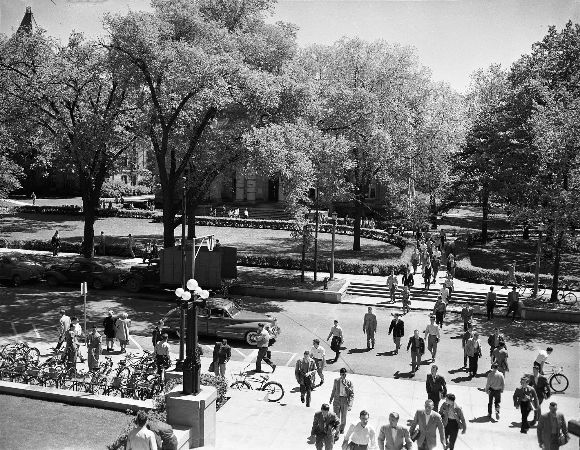 Students crossing State Street in front of the Michigan Union on the Ann Arbor campus, 1947