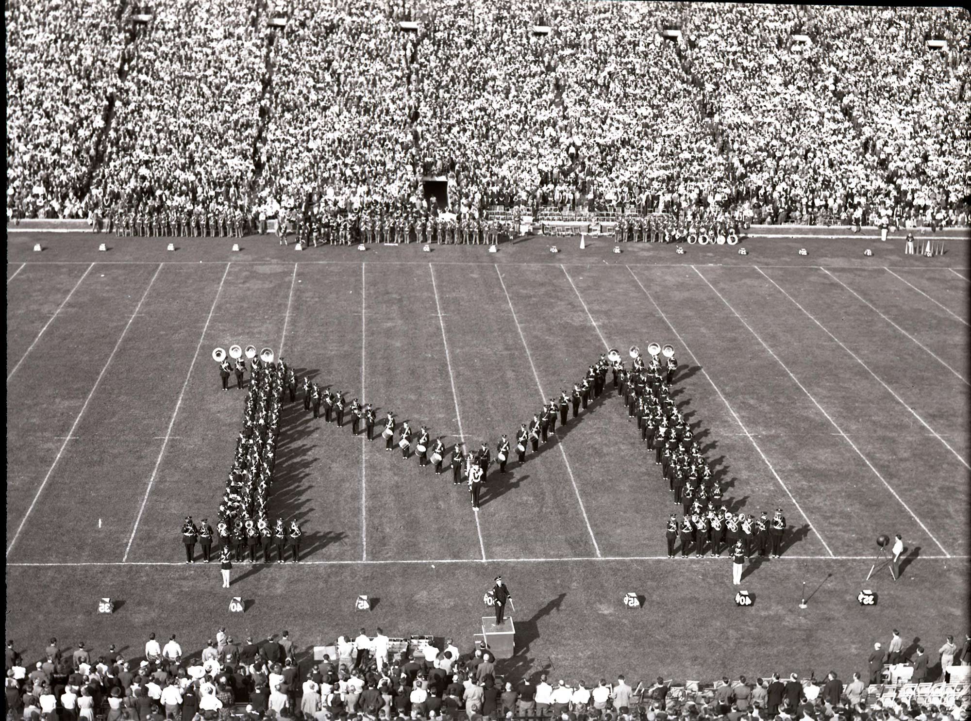 U-M Marching Band forming the Block M at the U-M vs. Michigan State football game on October 5, 1940.