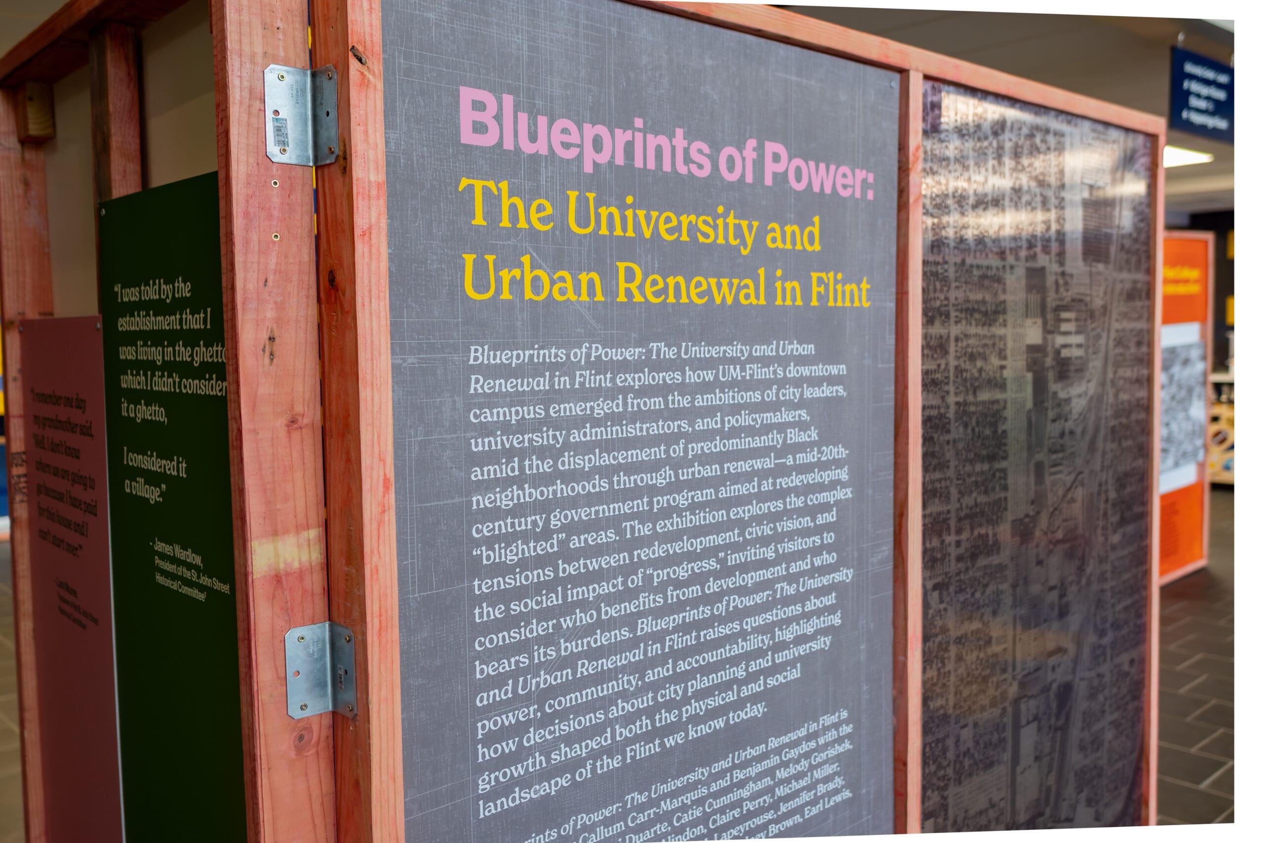 Colorful text on a gray exhibition panel.