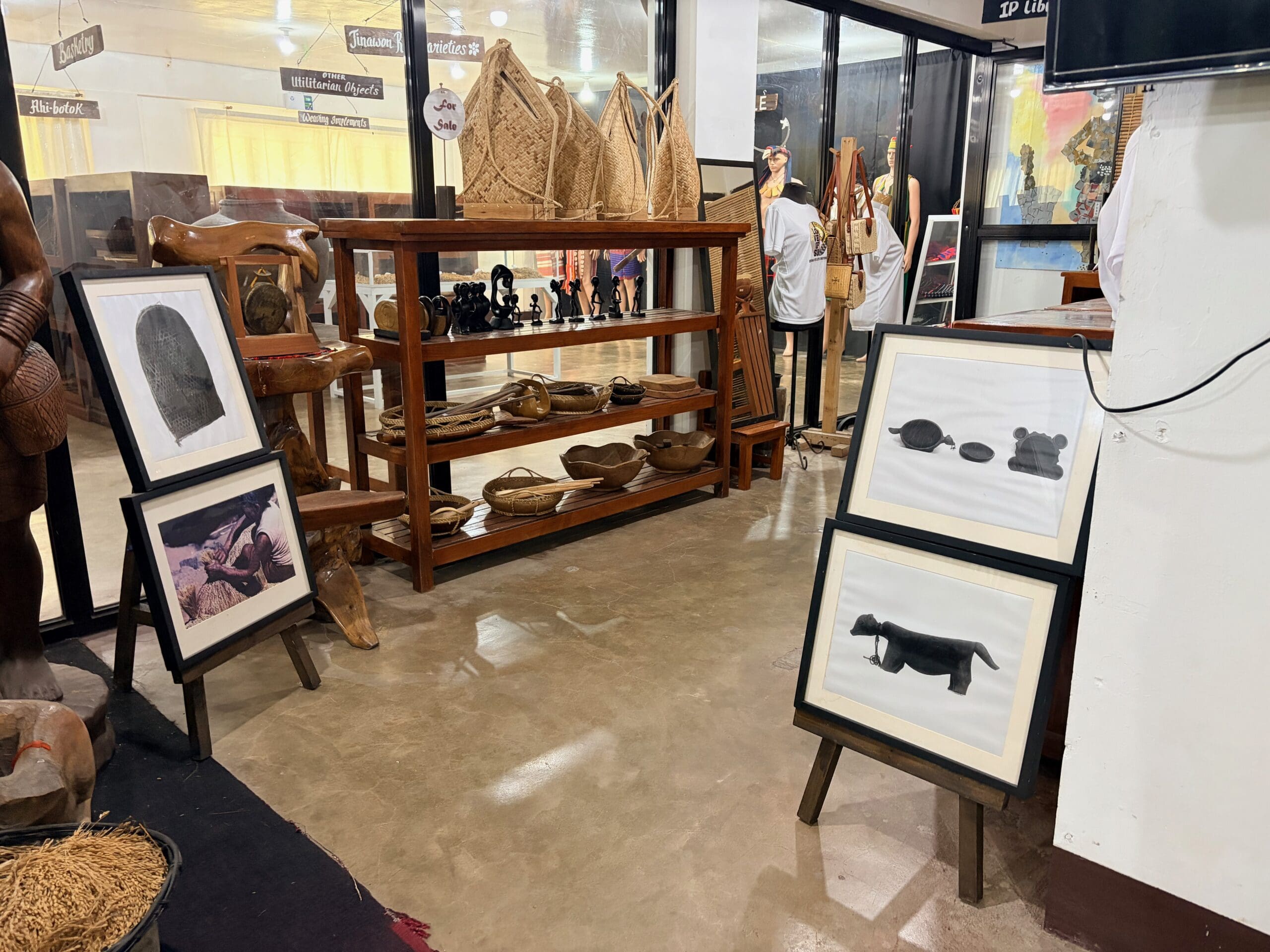 Framed images and woven baskets on display at the Ifugao Rice Cultural Museum.