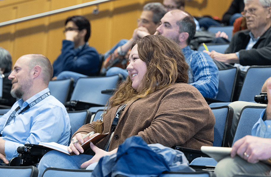 Smiling audience members on day 3 of the Living with Treaties conference.