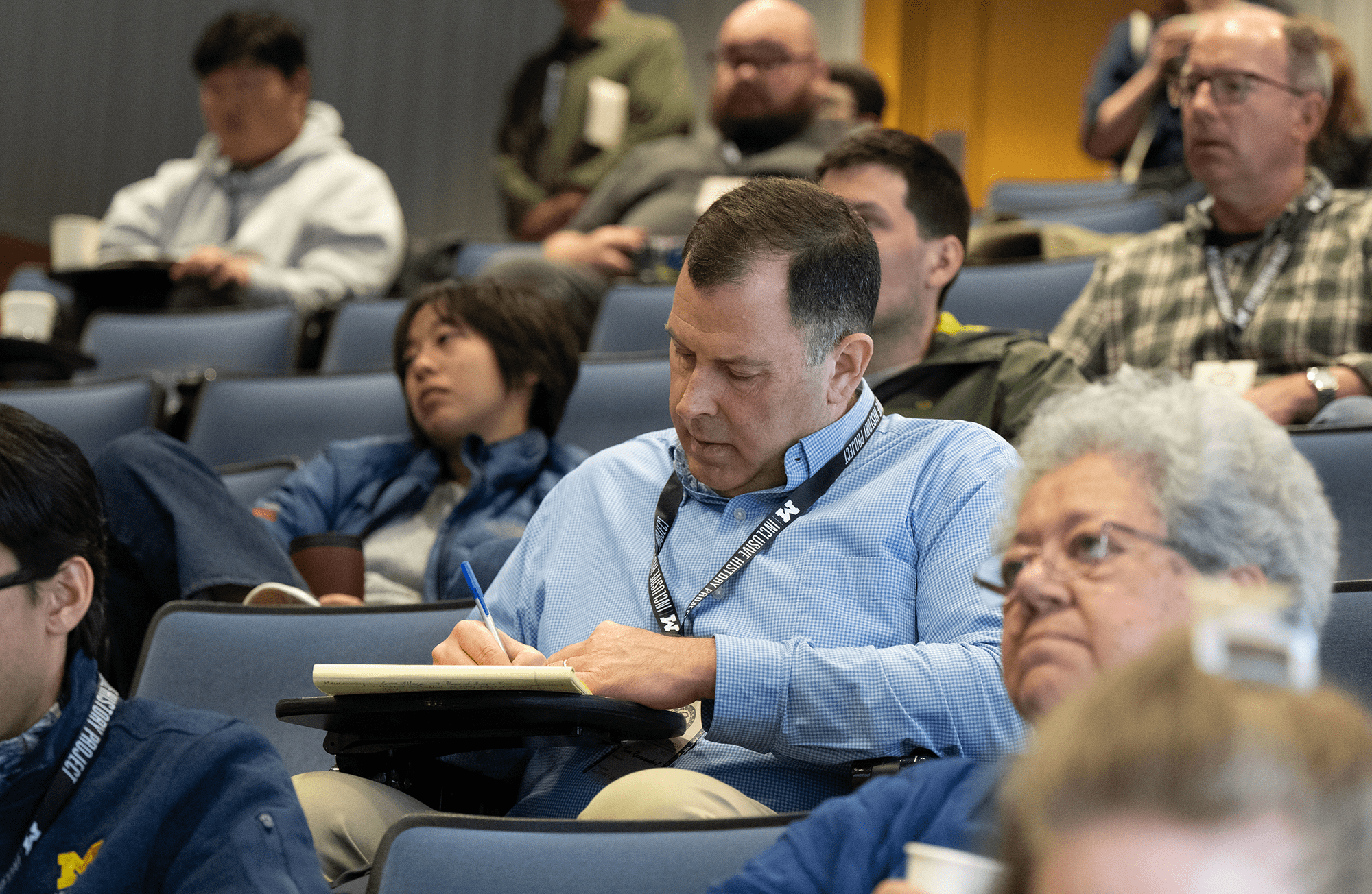 Audience members taking notes on Day 3 of the Living with Treaties conference.