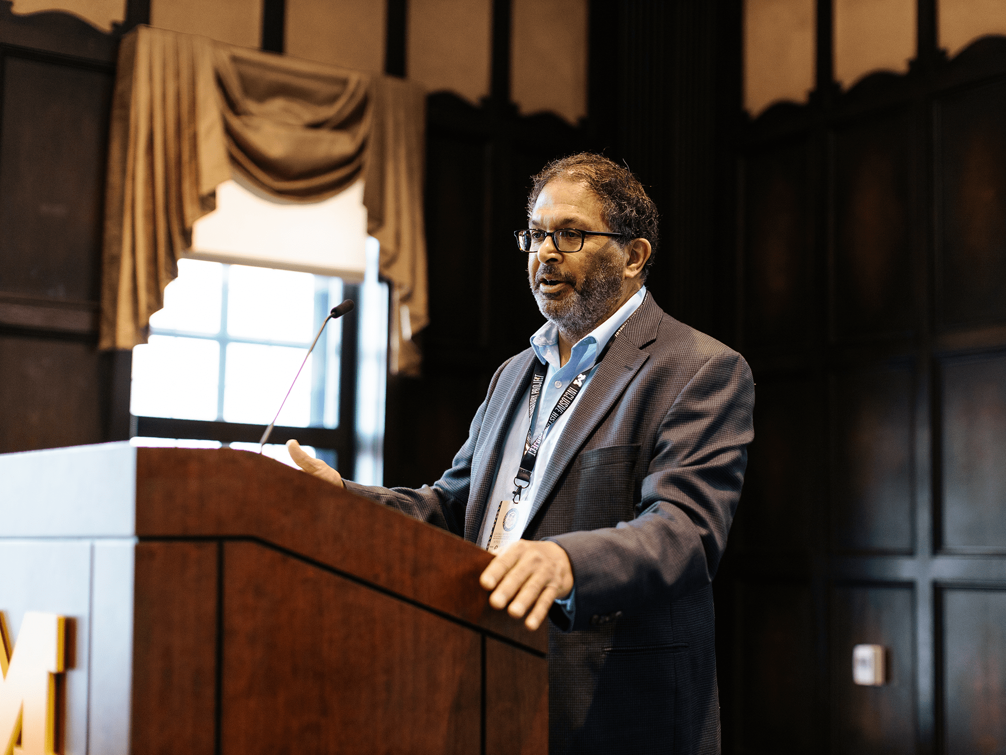 Panelist Riyaz Kanji speaks at the podium for the "How to Read A Treaty" panel.