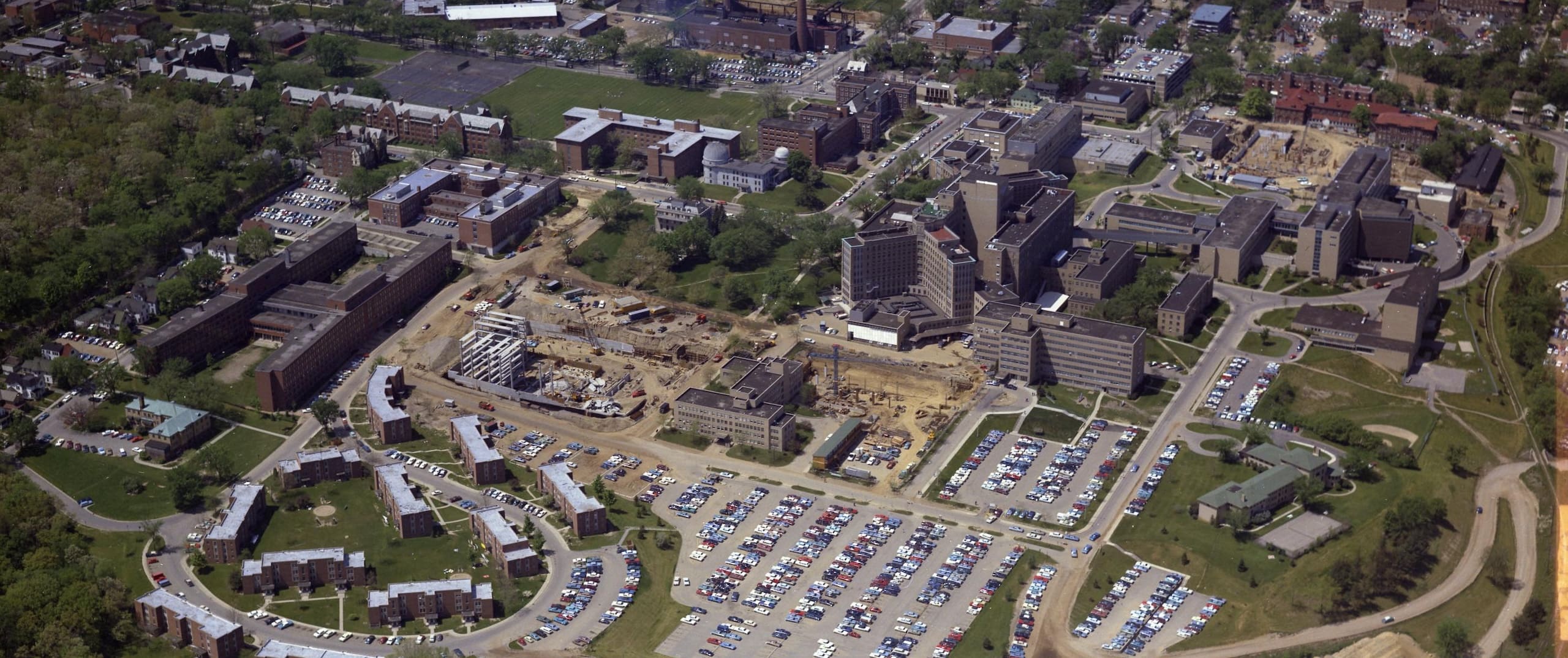 Colorized aerial view of Old Main Hospital at the University of Michigan, showing hospitals large footprint on the city of Ann Arbor and U-M campus.