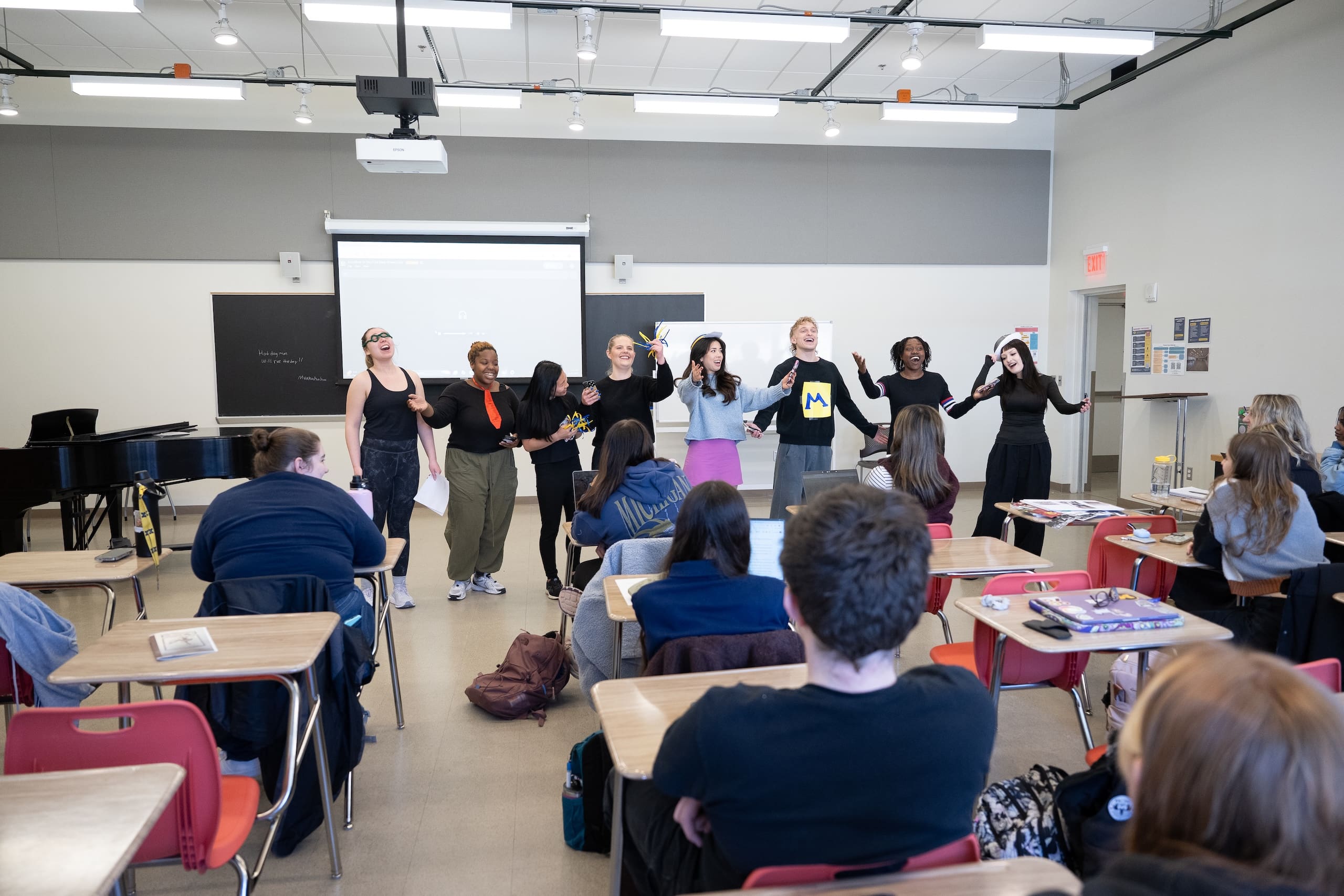 Students present final projects in a classroom.